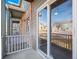 Exterior view of a building with brick and siding, a covered porch, and well-maintained landscaping at 5335 Pecos Way # 4, Denver, CO 80221