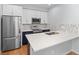 Modern kitchen features stainless steel appliances, ample counter space, and stylish backsplash at 5335 Pecos Way # 4, Denver, CO 80221