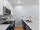 Modern kitchen features stainless steel appliances, ample counter space, and stylish backsplash at 5335 Pecos Way # 4, Denver, CO 80221