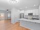 Modern kitchen featuring stainless steel appliances, white cabinets, and an island with a white countertop at 5335 Pecos Way # 4, Denver, CO 80221