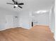Living area with hardwood floors that opens to a kitchen bar at 5335 Pecos Way # 4, Denver, CO 80221