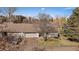 Street-level view of the property with a driveway and an attached garage at 14273 E Marina Dr, Aurora, CO 80014