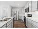 Modern kitchen featuring white cabinets, stainless steel appliances, and countertops at 487 Interlocken Blvd # 408, Broomfield, CO 80021