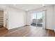 Bright living room featuring a sliding glass door to a balcony with bright light at 487 Interlocken Blvd # 408, Broomfield, CO 80021