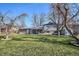 Backyard featuring a patio with outdoor seating, lawn and mature trees at 3406 E Fair Pl, Centennial, CO 80121