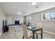 Finished basement with fireplace, modern flooring, and comfortable seating area at 3406 E Fair Pl, Centennial, CO 80121