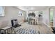 Finished basement featuring modern furniture, a geometric rug, and plenty of natural light at 3406 E Fair Pl, Centennial, CO 80121
