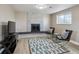 Basement living area with a cozy fireplace, modern decor, and ample space for relaxing at 3406 E Fair Pl, Centennial, CO 80121