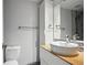 Sleek bathroom features a modern vessel sink, floating vanity, and mirrored cabinet, with modern fixtures at 3406 E Fair Pl, Centennial, CO 80121