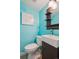 Vibrant powder room featuring a vessel sink, modern fixtures, and a contemporary design at 3406 E Fair Pl, Centennial, CO 80121