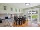 Open dining area with wood floors, a sliding glass door, and views of the backyard at 3406 E Fair Pl, Centennial, CO 80121