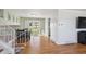 Bright dining area with hardwood floors, a stylish table set, and sliding doors leading to the backyard at 3406 E Fair Pl, Centennial, CO 80121