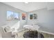 Bright office space with a white desk, cozy chair, and a decorative rug, perfect for remote work at 3406 E Fair Pl, Centennial, CO 80121