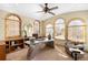 Bright home office with natural light, arched windows, and a modern desk at 566 Monroe St, Denver, CO 80206