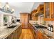 Open kitchen with granite countertops, stainless steel appliances, and hardwood floors at 566 Monroe St, Denver, CO 80206