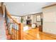 Inviting living room with hardwood floors, staircase and a cozy fireplace at 566 Monroe St, Denver, CO 80206