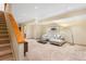 Basement living room with plush carpet, modern furniture, and recessed lighting at 566 Monroe St, Denver, CO 80206