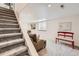 Spacious finished basement features stairs, seating, and plenty of room at 1382 Braewood Ave, Highlands Ranch, CO 80129