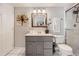 Bathroom features vanity, drawers, toilet, mirror, and shower at 1382 Braewood Ave, Highlands Ranch, CO 80129