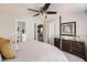 Cozy main bedroom features ceiling fan, and ensuite bathroom at 1382 Braewood Ave, Highlands Ranch, CO 80129