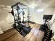 Basement gym with hardwood floors and a variety of exercise equipment at 1560 Quince St, Denver, CO 80220