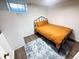 Cozy bedroom features plush rug, modern bed frame and a bright orange comforter set at 1560 Quince St, Denver, CO 80220