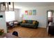 Bright living room featuring hardwood floors, comfortable sofa, and stylish decor, creating an inviting space at 1560 Quince St, Denver, CO 80220