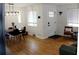 Well-lit living room with hardwood floors, modern lighting fixtures, and stylish decor creating a warm atmosphere at 1560 Quince St, Denver, CO 80220