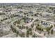 Expansive aerial view of the neighborhood, showcasing house and barn, set amongst trees at 3562 Pine Meadow Ave, Parker, CO 80138