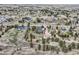 Extensive neighborhood aerial view with trees dotting the landscape, home, and barn at 3562 Pine Meadow Ave, Parker, CO 80138