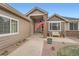 Inviting front porch with brick accents, flag, bench, and walkway, offering a warm welcome at 3562 Pine Meadow Ave, Parker, CO 80138
