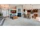 Comfortable living room showcasing an open layout, bar seating, and seamless flow to other living spaces at 3562 Pine Meadow Ave, Parker, CO 80138