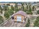 Outbuilding with a large garage door and convenient parking perfect for storing recreational vehicles at 3562 Pine Meadow Ave, Parker, CO 80138