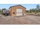 Large outbuilding with ample parking, ideal for RV storage, set in a picturesque landscape at 3562 Pine Meadow Ave, Parker, CO 80138