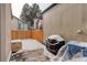 Small, snowy backyard with grill and storage at 3742 S Danube Cir, Aurora, CO 80013