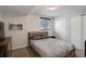 Basement bedroom with a double bed and gray bedding at 3742 S Danube Cir, Aurora, CO 80013