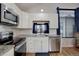 Modern kitchen with stainless steel appliances and granite countertops at 3742 S Danube Cir, Aurora, CO 80013