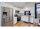 Modern kitchen with stainless steel appliances and granite countertops at 3742 S Danube Cir, Aurora, CO 80013