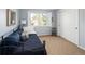 Bedroom with a window with shutters, white walls, and a closet at 10886 E Berry Ave, Englewood, CO 80111