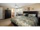 Comfortable bedroom with a ceiling fan, a window with shutters, and an ensuite bathroom at 10886 E Berry Ave, Englewood, CO 80111