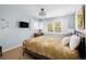Bedroom with shutters on the window and neutral paint at 10886 E Berry Ave, Englewood, CO 80111