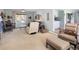 Cozy living room with neutral tones, comfortable seating, and a bright window showcasing natural light at 10886 E Berry Ave, Englewood, CO 80111