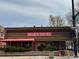 Exterior of Dazbog Coffee with outdoor seating, a vibrant sign, and convenient walkability at 1050 N Corona St # 316, Denver, CO 80218
