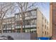 Apartment building exterior with brick and large windows for natural light at 1050 N Corona St # 316, Denver, CO 80218