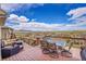 Outdoor deck with dining area, lounge seating, and panoramic mountain views at 13325 W 86Th Dr, Arvada, CO 80005