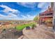 Scenic backyard with a multi-level deck, fire pit, and expansive views at 13325 W 86Th Dr, Arvada, CO 80005