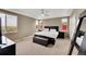 Spacious bedroom with neutral paint, a ceiling fan and large windows for plenty of natural light at 13325 W 86Th Dr, Arvada, CO 80005