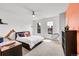 Bright bedroom featuring plush carpet, a ceiling fan, and natural light from large windows at 13325 W 86Th Dr, Arvada, CO 80005