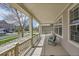 Spacious covered porch offering a relaxing outdoor seating area at 13325 W 86Th Dr, Arvada, CO 80005