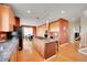 Well-equipped kitchen with stainless steel appliances, a central island, and a breakfast nook at 13325 W 86Th Dr, Arvada, CO 80005